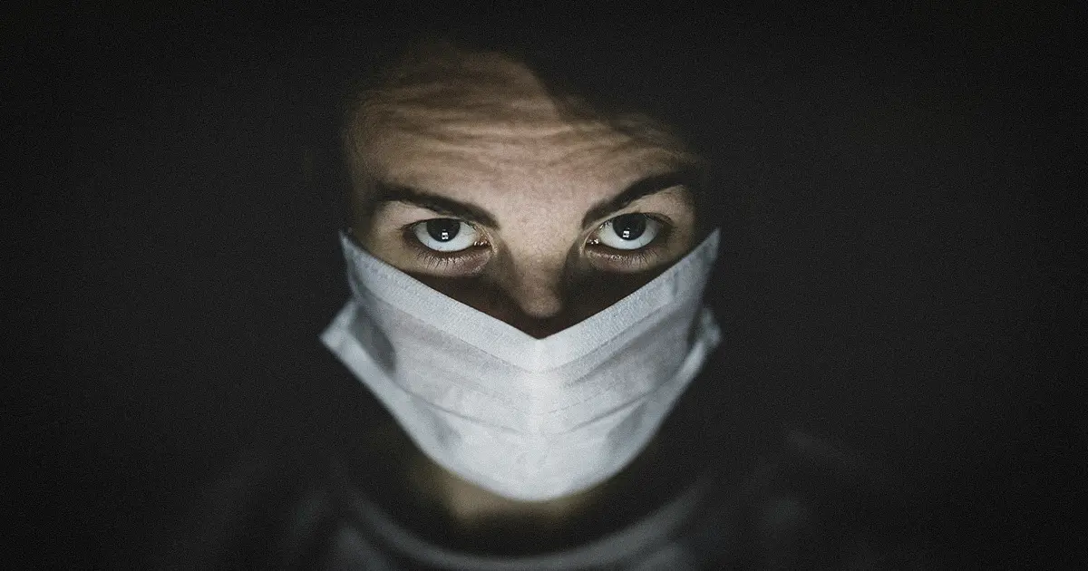 A man wearing a mask to protect from virus and bacteria in the air.